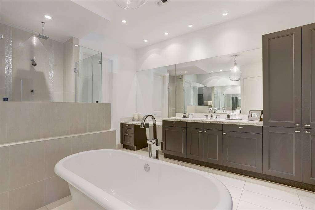 Another view of one vanity area, with ample storage, linen closet and tons of counter top space.