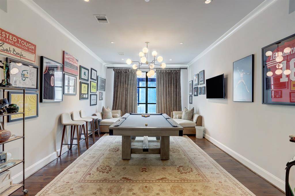 Large formal dining room that is currently being used as a game room.