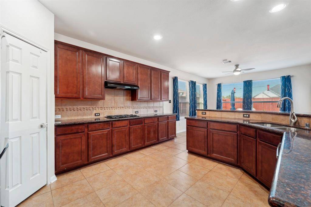 The Kitchen has a wealth of cabinetry and counter space!