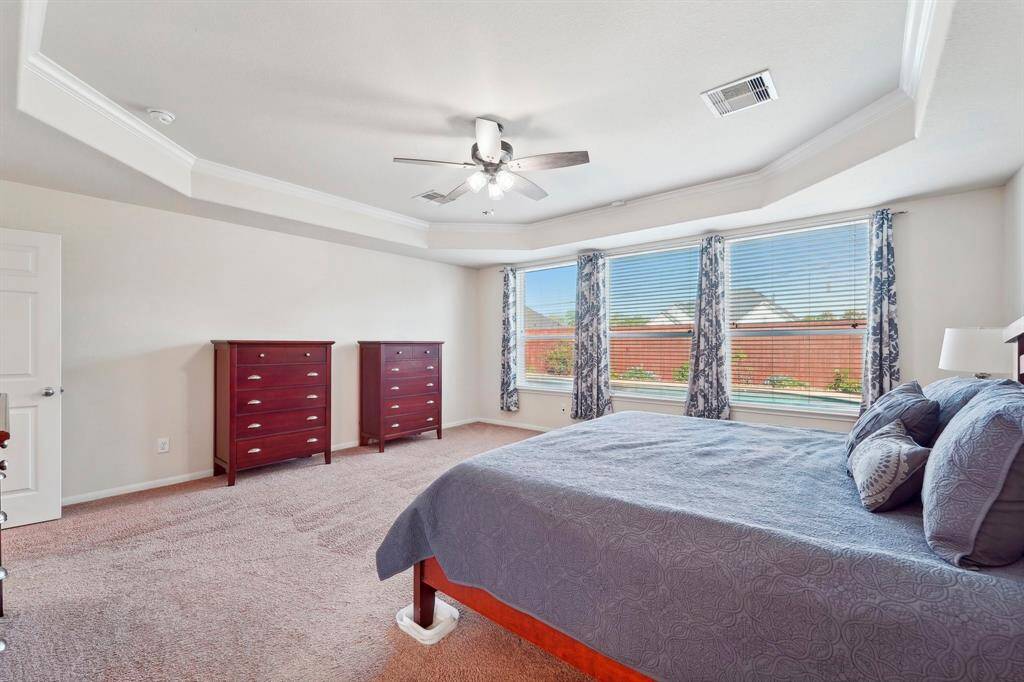 This room is sprawling and has tons of space for a sitting area