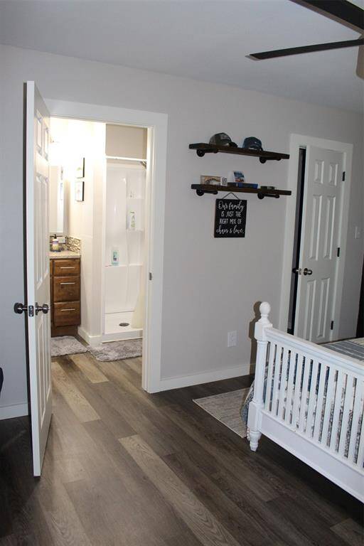Open door shows access to full bath with additionally entry right off the main living area.