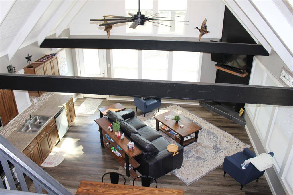Exposed beams, looking from loft down to main living area.