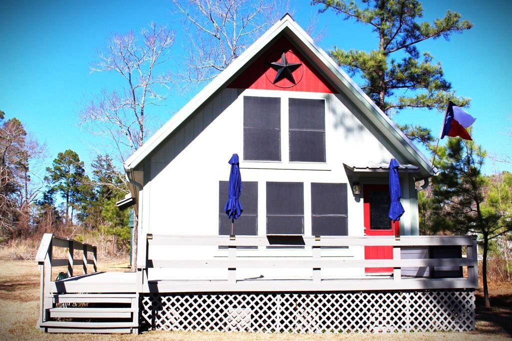 Enjoy amazing views with this L shaped wrap around porch.