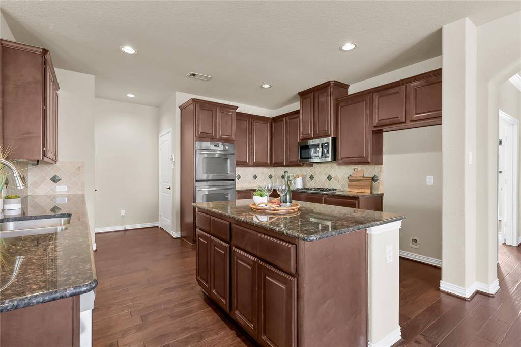 Built in cabinets in the island gives lots of extra storage room for bulky appliances