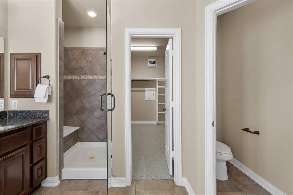 Beautiful primary suite offers his and hers sinks, a relaxing soaking tub, separate walk-in shower as well as an expansive walk-in closet