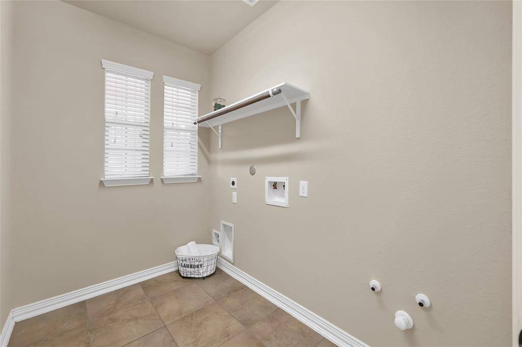 Laundry room with built in shelving, and hangar rod