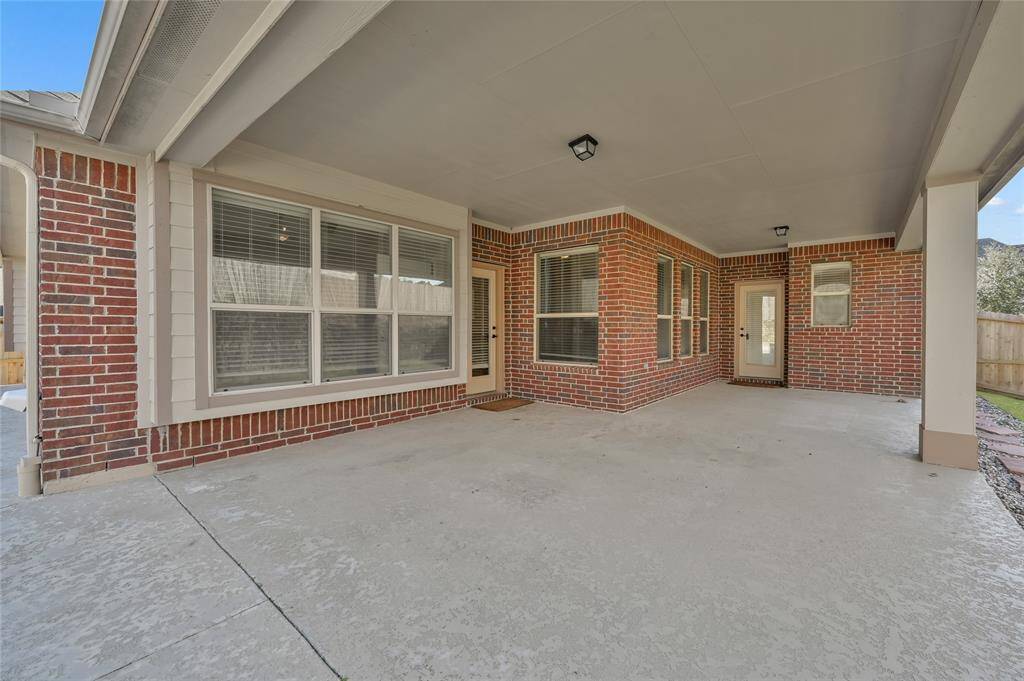 Your large covered back porch has ample space for outdoor entertainment, rain or shine!