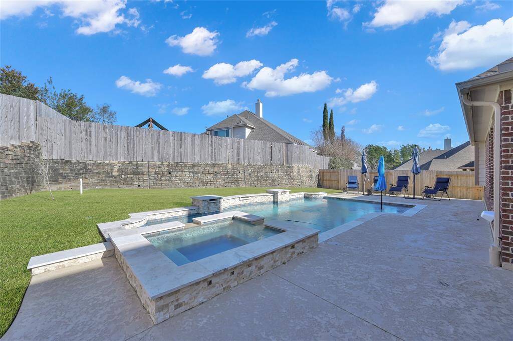 Sit beside your brand new pool, or take a dip in the hot tub in this chilly weather! With the waterfall feature, you will have a relaxing oasis in your own backyard!