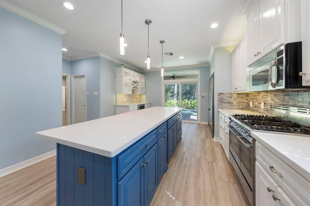 Abundant cabinetry provides ample storage, ensuring all your kitchen essentials are neatly organized and easily accessible.