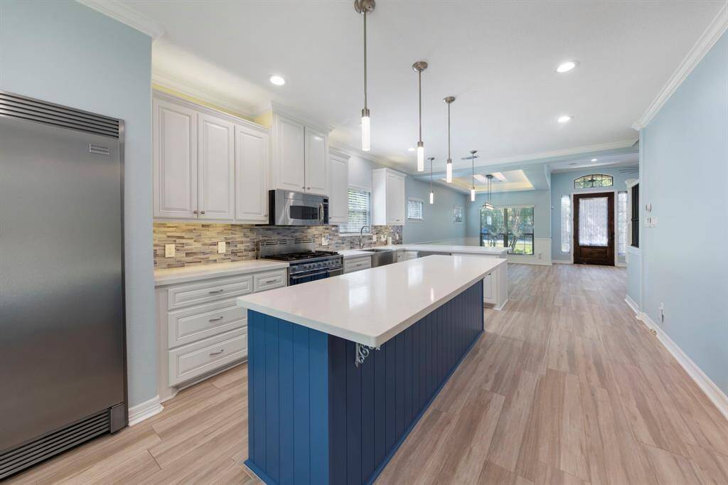 The kitchen offers a beautiful view of the dining room, creating an inviting atmosphere for entertaining and family gatherings.