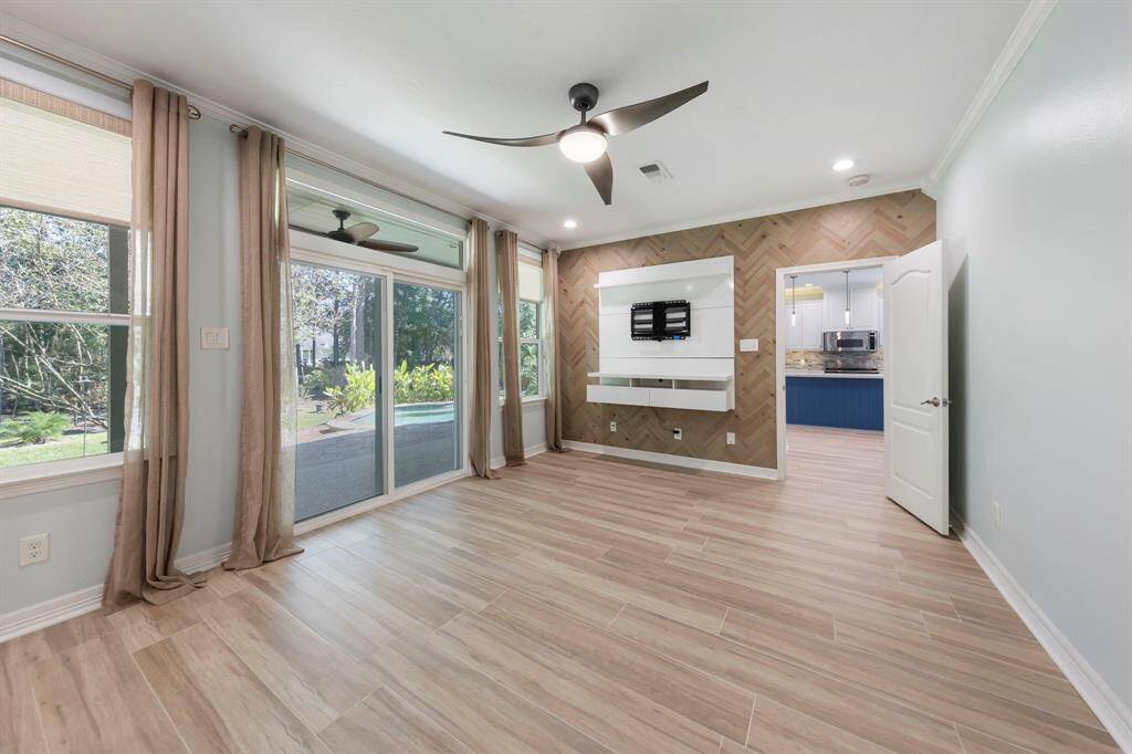 An accent wall features a built-in entertainment space, complete with a TV mount, ready for your favorite shows and movie nights.