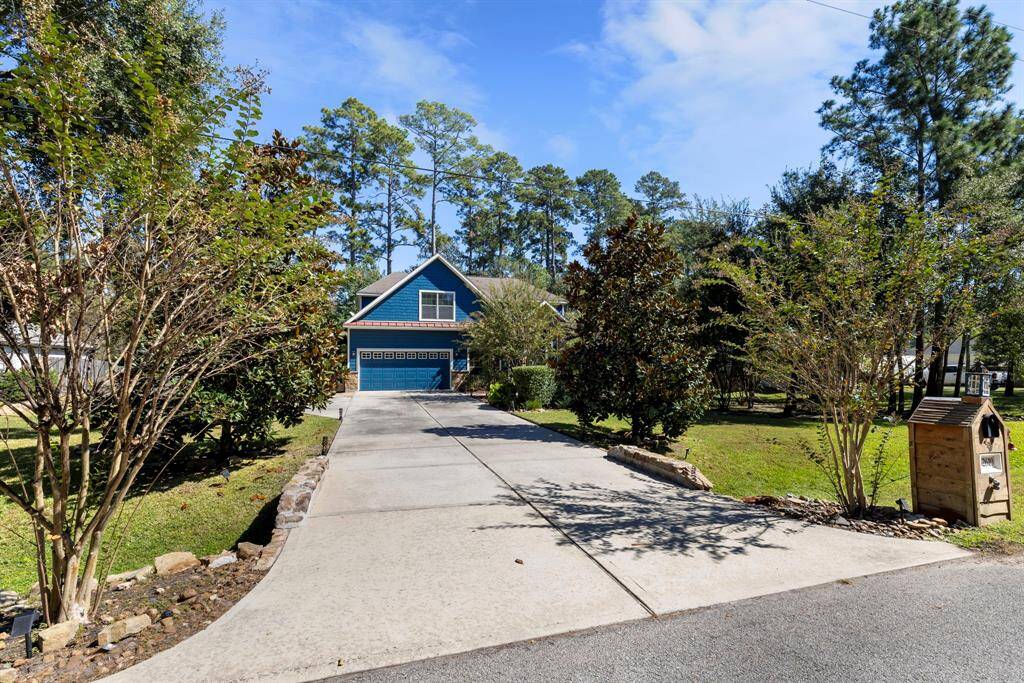 An extra-long driveway leads to this hidden gem, tucked away amidst lush landscaping, offering enhanced privacy and seclusion.