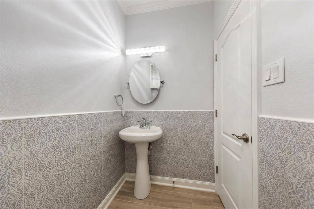 A conveniently located half bath on the first floor offers easy access for guests.