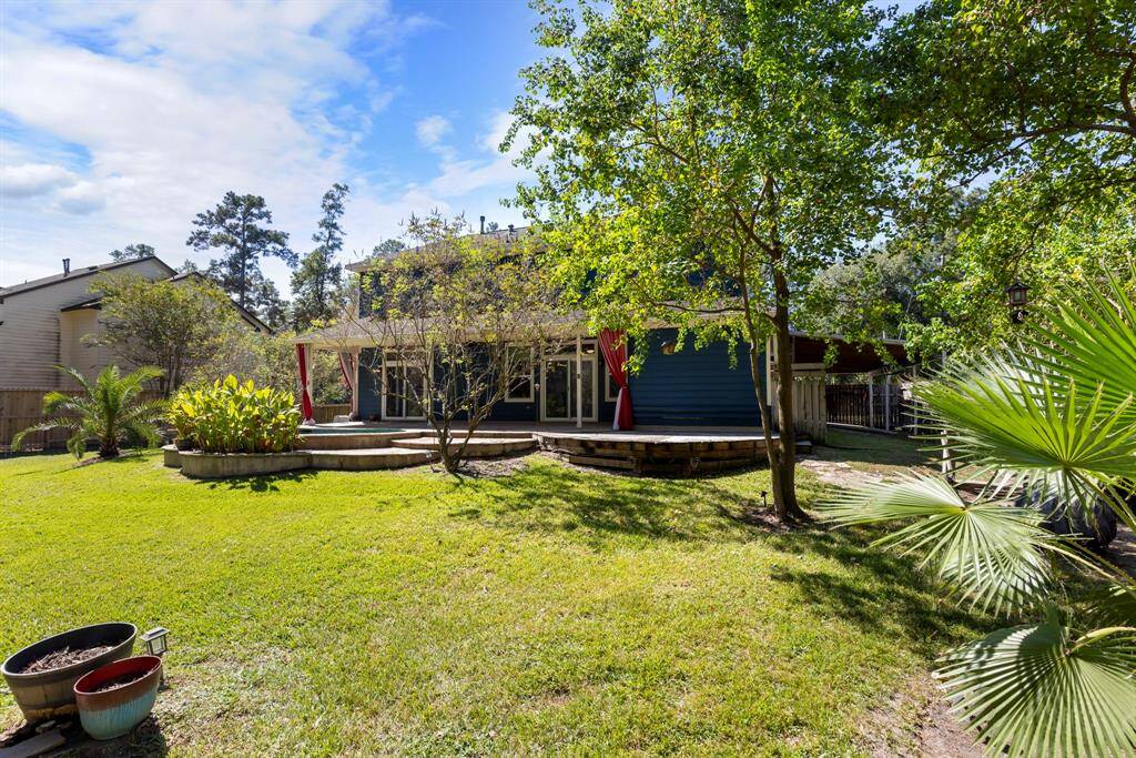 This home is nestled on nearly half an acre, offering an expansive backyard with plenty of space for outdoor activities.