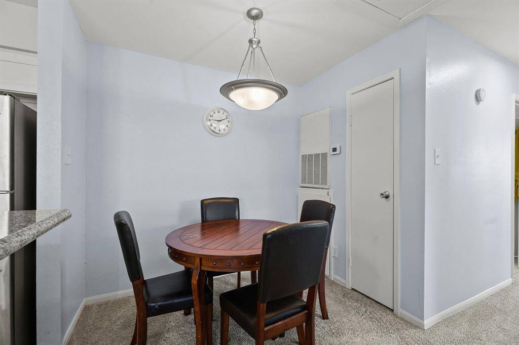 The living room is open to the dining area as well as the ...