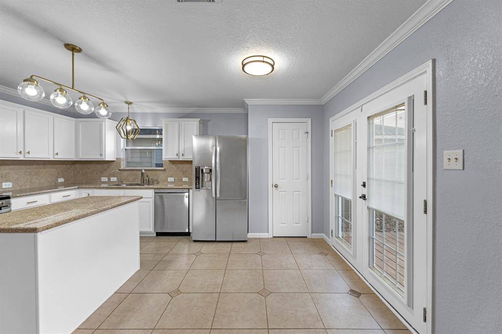 Breakfast Area with French doors to patio and spacious backyard.