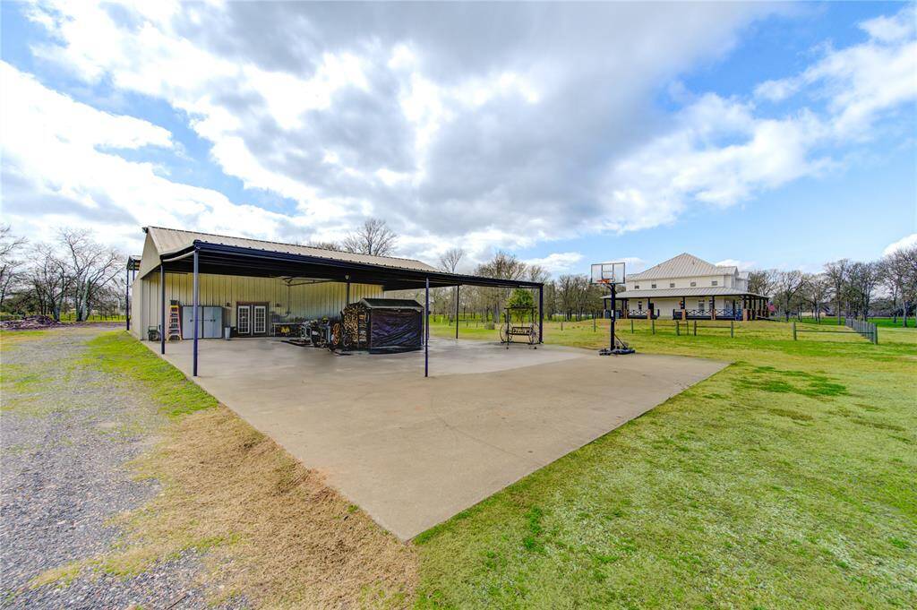 This detached dwelling features outdoor storage and an entertainment space. It includes a spacious covered slab as well media room with office, kitchen and full bath.