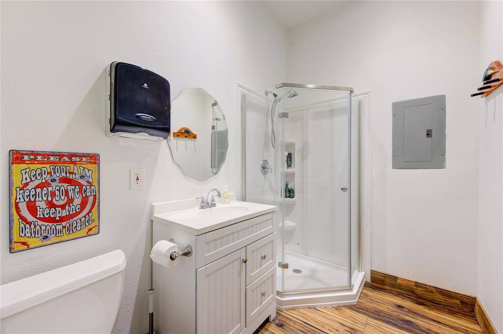 Full bath with standup shower, right off of media room.