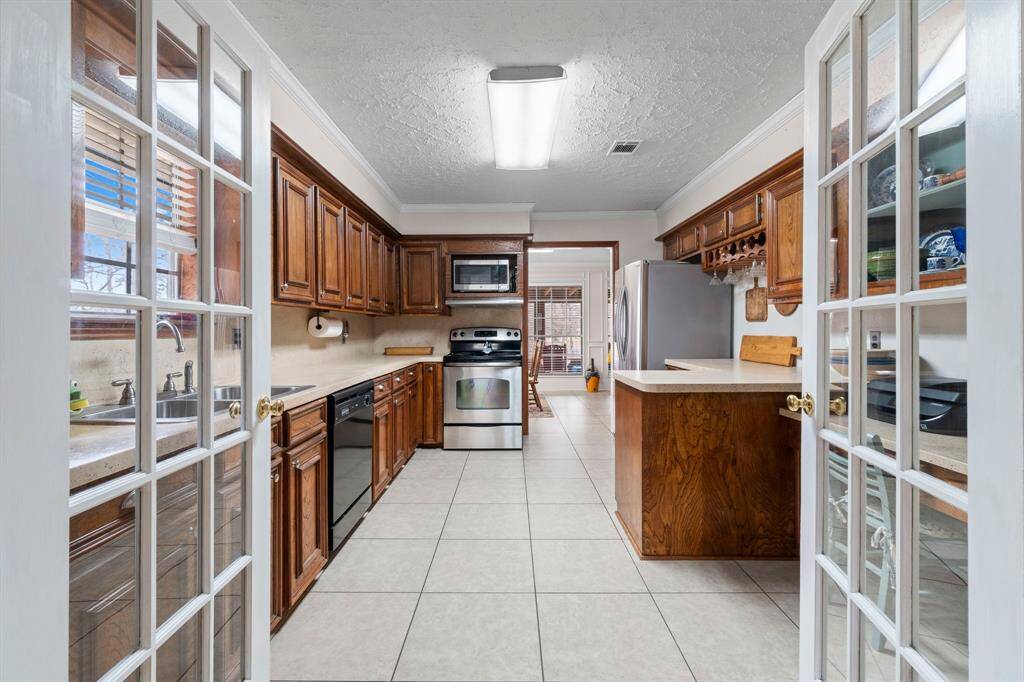 French doors can be open or just close off the flex room for privecy.Built-in desk in the kitchen.