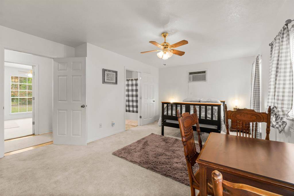 To the left is the hall from the stairs and each bedroom has its own entrance.  The full bath is centrally located between both bedrooms.  This guest quarters has a separate hot water heater.