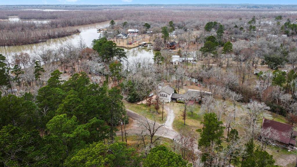 Aerial of the home and water.
