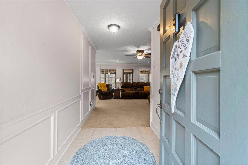Enter through the front door into the beautiful foyer that opens into the living and dining room.
