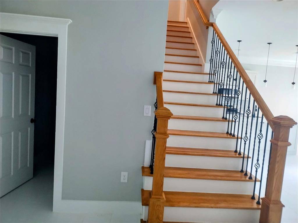Stairs with wood detailed handrails