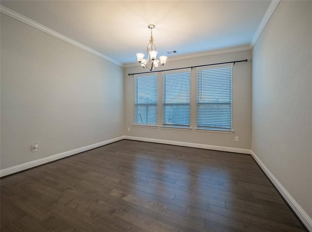 as you continue down the entrance hallway after the office on your left you have your formal dining room