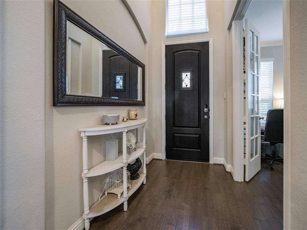 as you enter this beautiful wood door you will be greeted by the outstanding wooden floors, tall ceilings lots of natural light