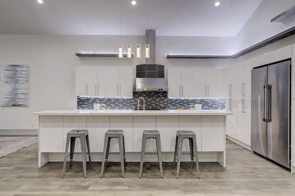 This kitchen is built to accommodate small or large gatherings.  You will love the 18' ceiling with a few windows that were added to allow more natural light.
