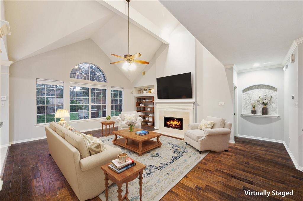 Family room with an open concept.  Gas log fireplace and high ceilings make this room great for entertaining.