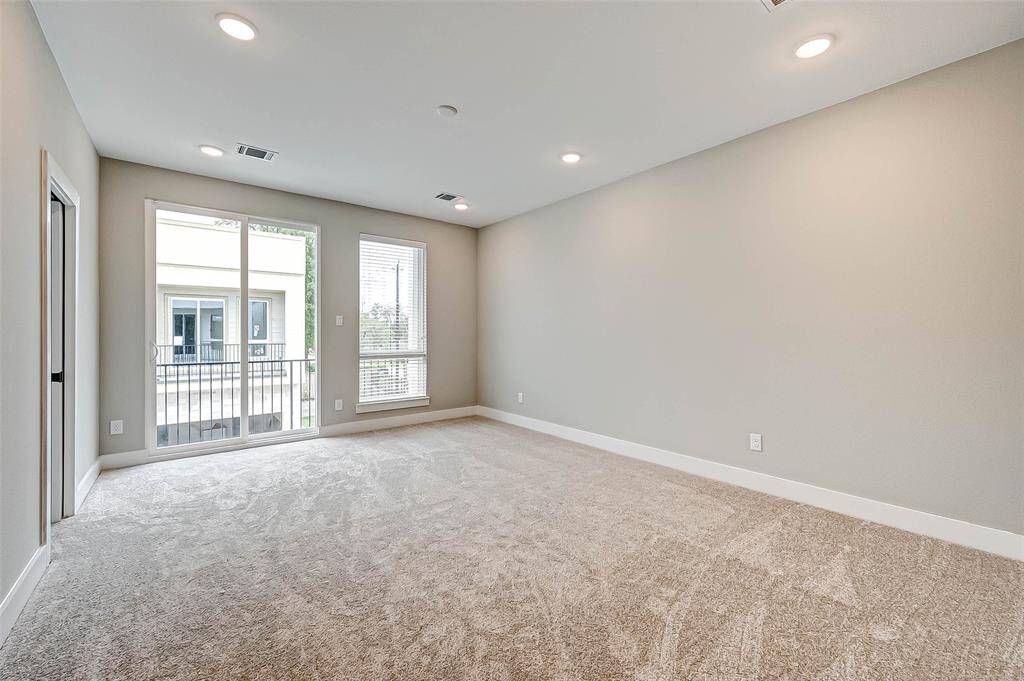 The primary bedroom has a 12' long balcony.