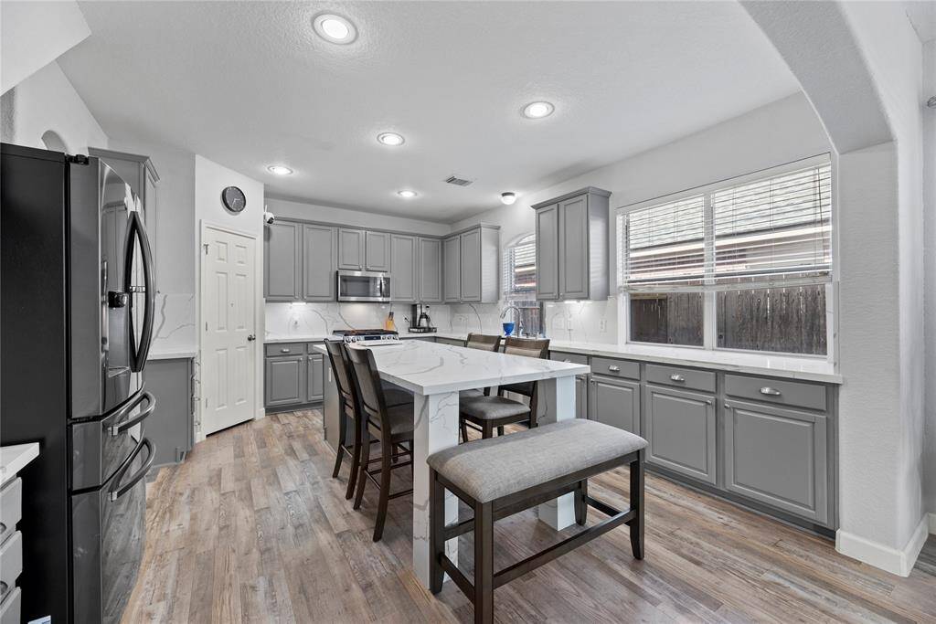 Kitchen with large island and lots of lighting!