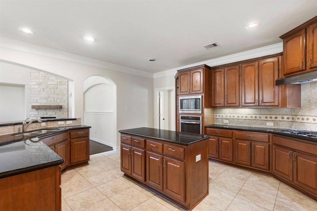 The chef of the house will love having all this kitchen space for meal prep + Ample cabinets!