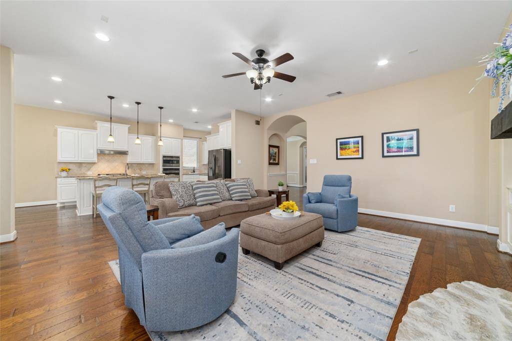 Open concept floorplan with family room adjacent to the gourmet kitchen