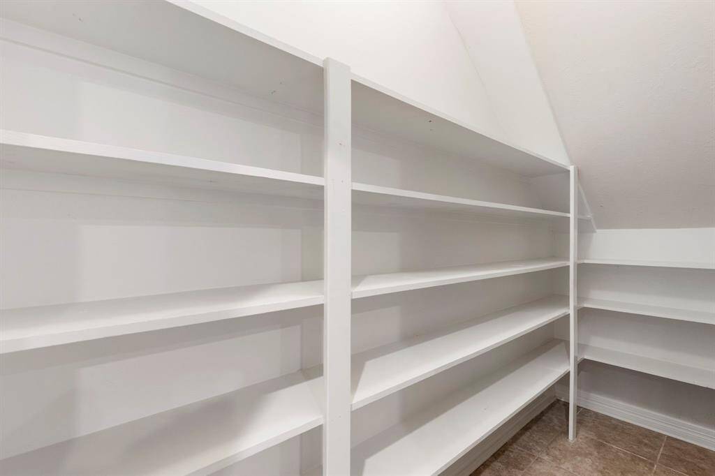 Huge pantry built under the stairs.