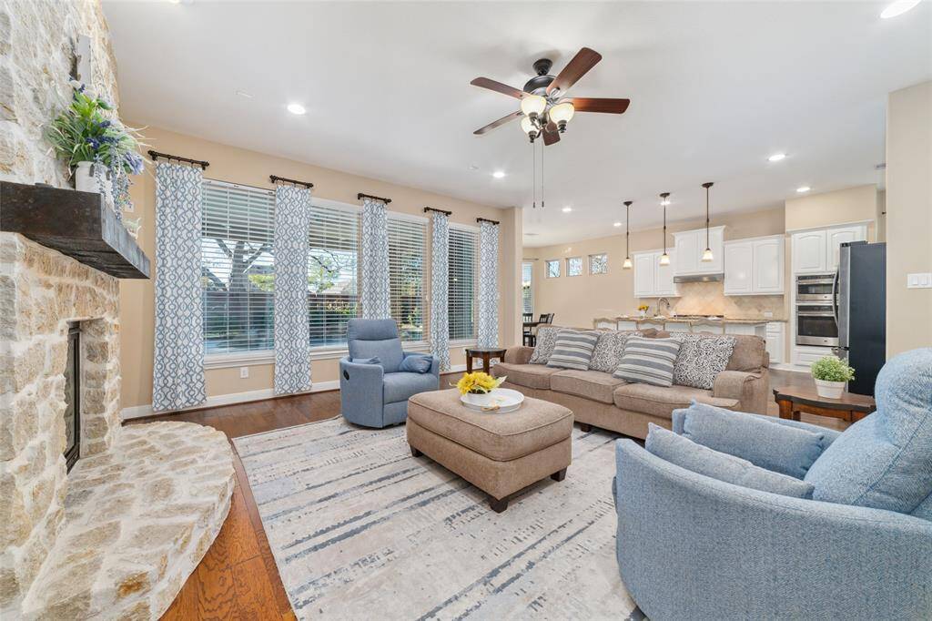 Open concept floorplan with family room adjacent to the gourmet kitchen