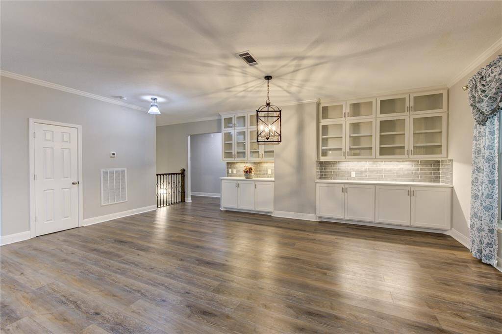 The custom-built ins in the dining room add both charm and functionality, offering the perfect space for displaying fine china, decorative accents, or treasured keepsakes.