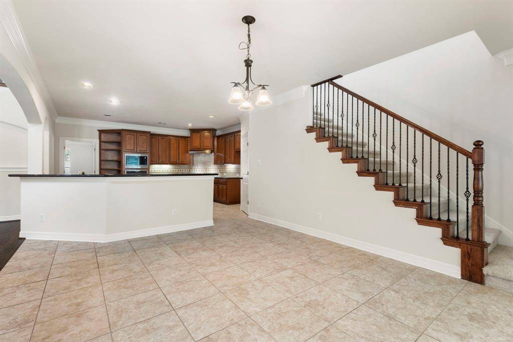 The kitchen also provides additional seating options at the breakfast bar.