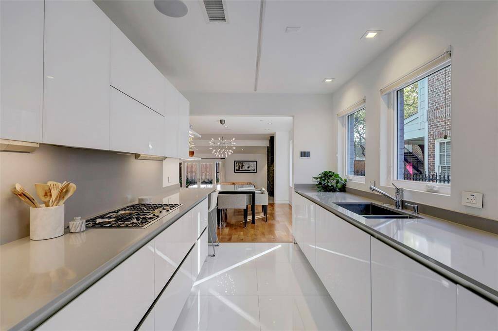 You'll love cooking in this kitchen with endless counter space, Miele appliances, natural light and pretty views.