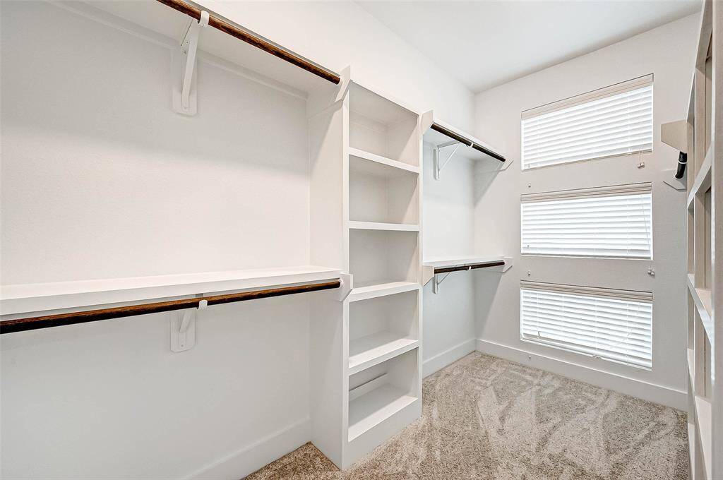 The master suite has an enormous 6x11 SF walk in closet with custom built ins and natural light source.