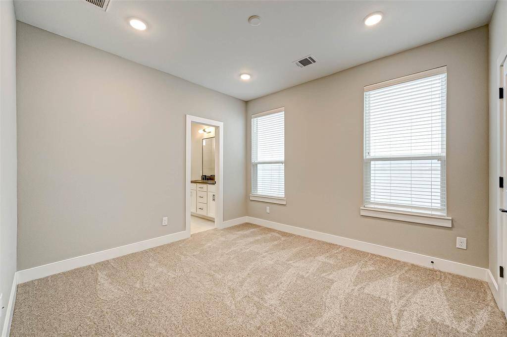 The 11x13 SF second bedroom has carpet, recessed lighting, walk in closet and 2" blinds.