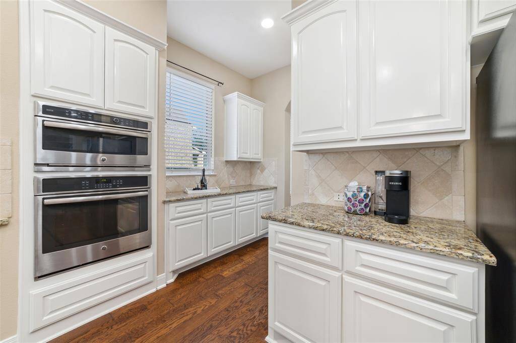 42" wood cabinetry by the Butler's Pantry. Plenty of storage for all your kitchen items.