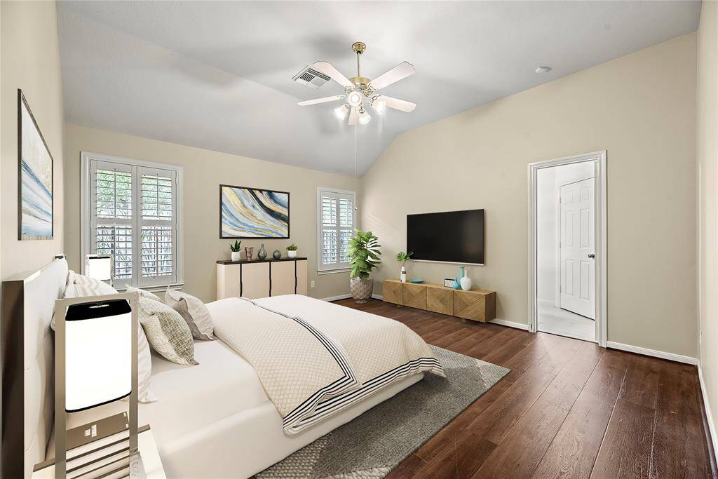 Primary bedroom with walk-in closet