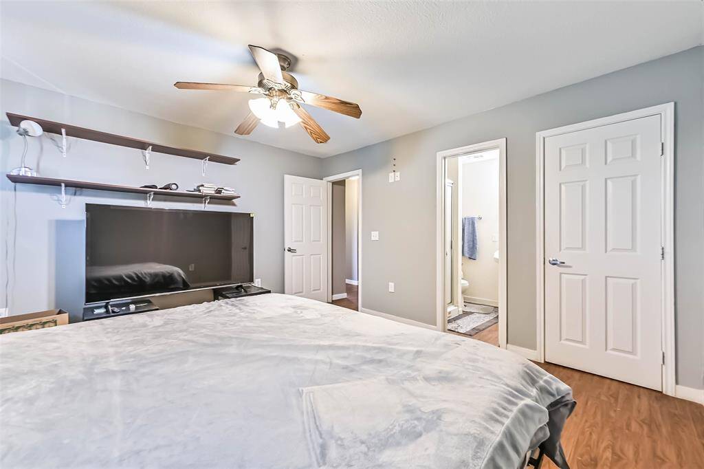 Primary looking at attached bathroom and walk-in closet.