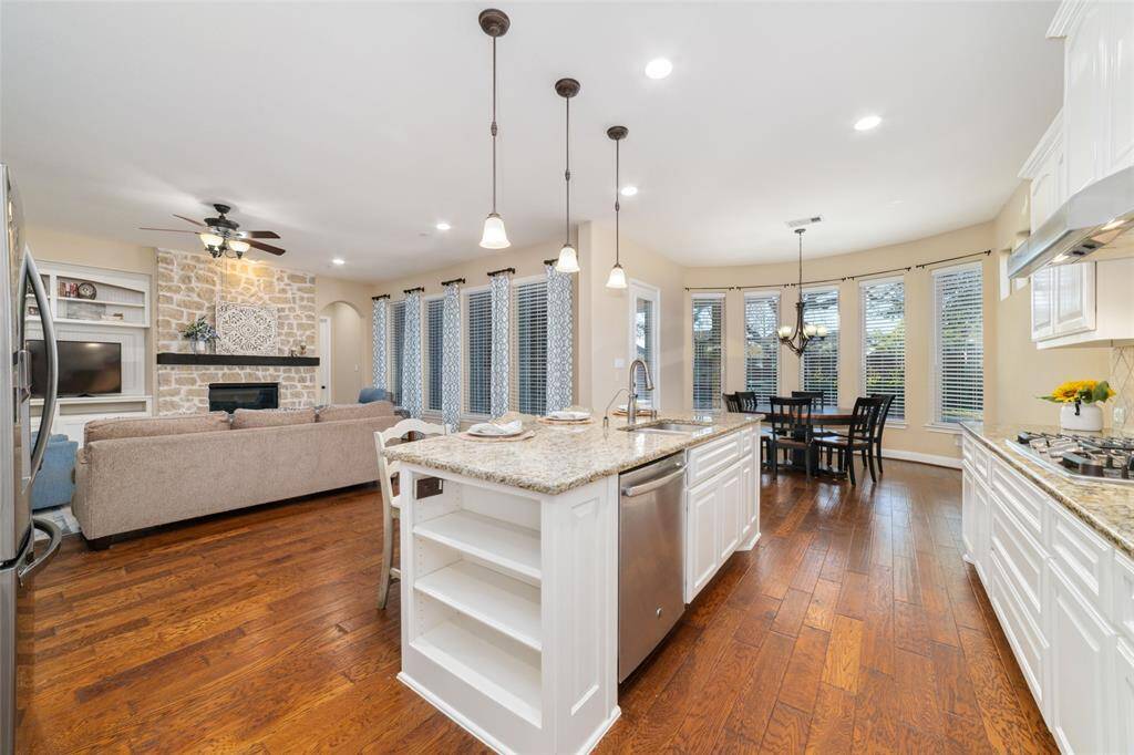 Opposite view of the kitchen facing the breakfast area and family room