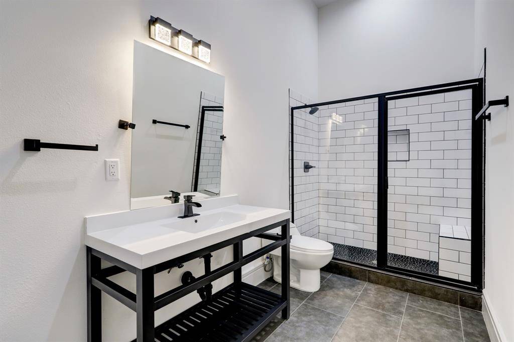 (1) of (3) secondary ensuite full bathrooms.
