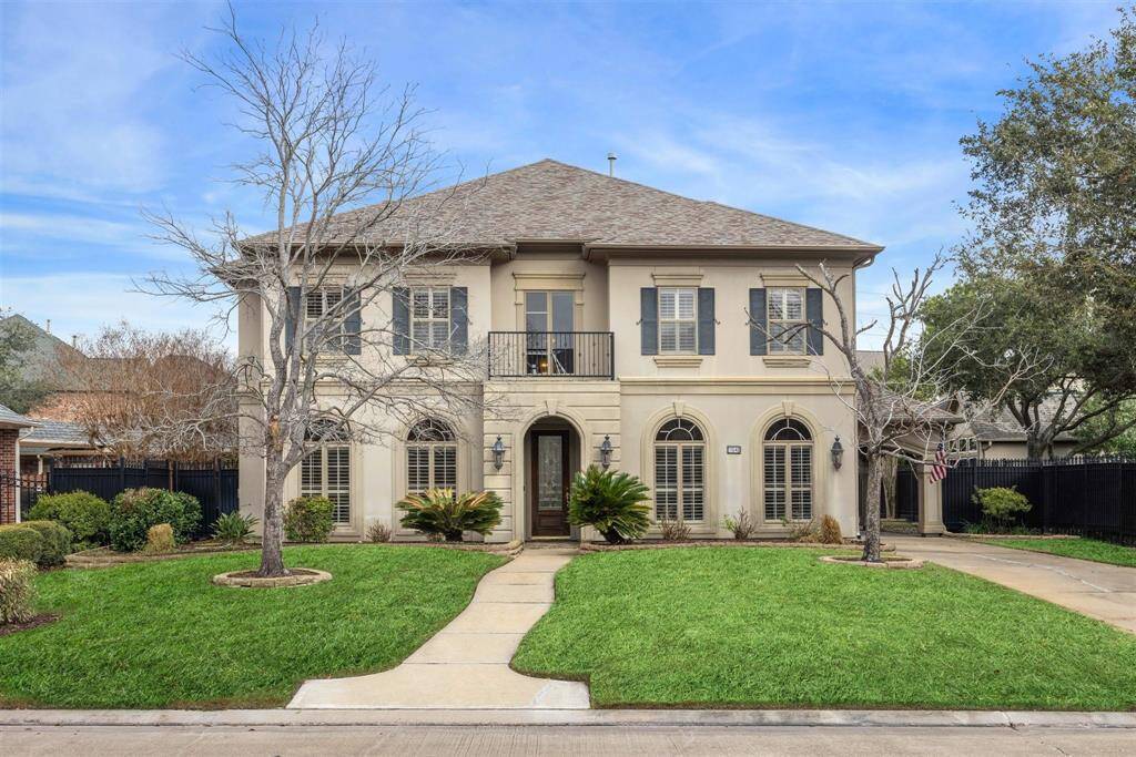 GRACIOUS LIVING IN THIS TRADITIONAL STUCCO HOME IN ROYAL OAKS COUNTRY CLUB - 2-story home on a large lot, with graceful arched windows on the lower level and contrasting color shutters on the upper level