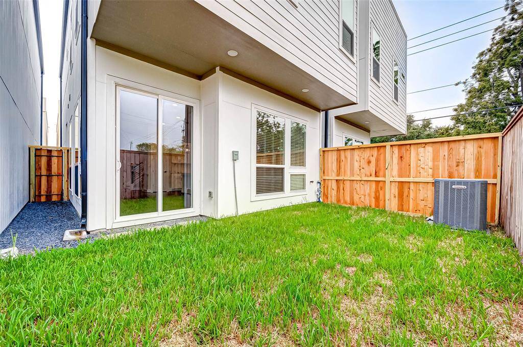 The back yard has a covered patio area.