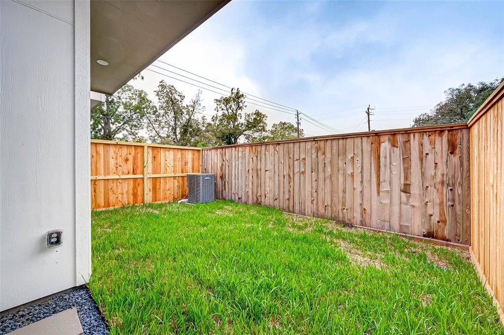 The back yard is fully fenced.